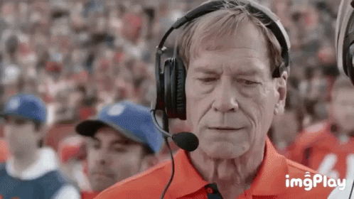 Older Man With Headphones And Microphone Watching Football GIF