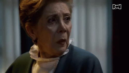 Older Woman Crying in Front of TV With BC