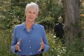 Older Woman in Blue Shirt in Forest