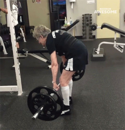 Older Woman Lifting Barbell Saying Awesome