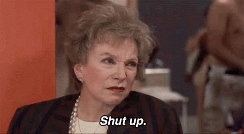 Older Woman Saying Shut Up Sitting in Room