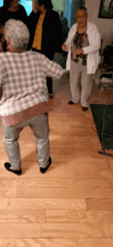Older Women Dancing in Room