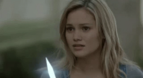 Olivia Holt Holding Dagger GIF