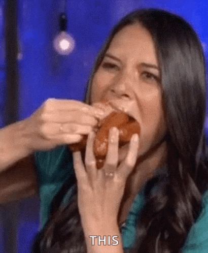 Olivia Munn Fitting Sausages In Mouth GIF