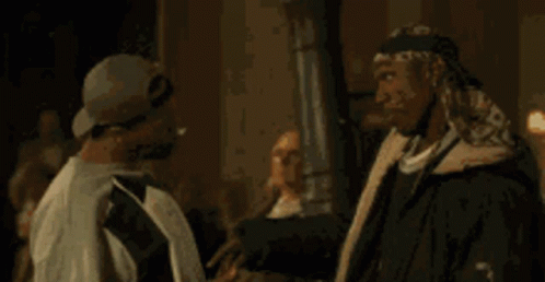 One Man Saying Popcorn To Another GIF