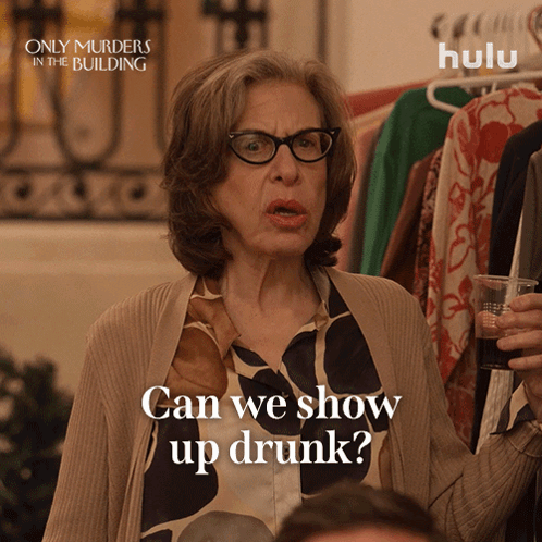Only Murders In The Building Ad Woman Holding Glass GIF