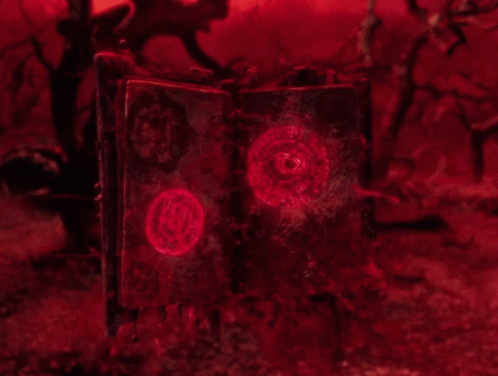 Open Book With Red Glowing Circle GIF