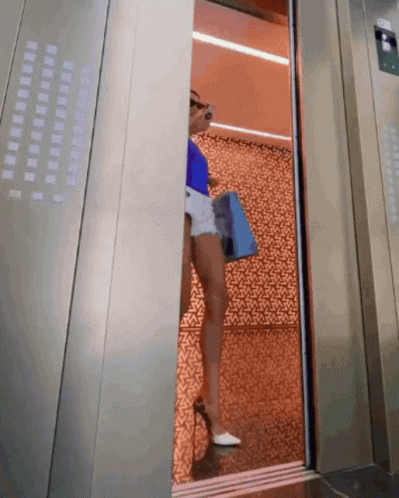 Opening Elevator With Long Legs GIF