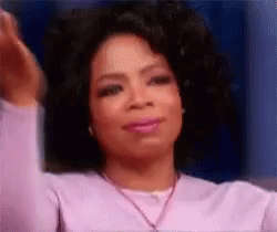 Oprah Winfrey Making Funny Face in Purple Sweater