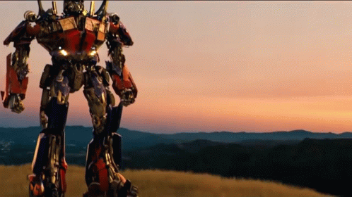 Optimus Prime Walking On Beautiful Sunrise View GIF