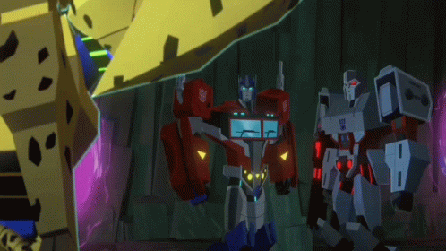 Optimus Prime and Megatron Standing in Dark Room
