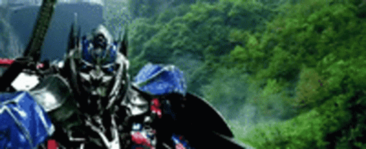 Optimus Prime Dodging Enemy Attack GIF