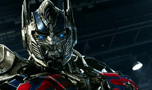 Optimus Prime Standing in Dark Room