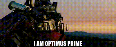 Optimus Prime Standing in Front of Sunset With Telescope on Head