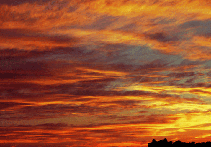 Orange Clouds Moving Above Scorching Sky GIF