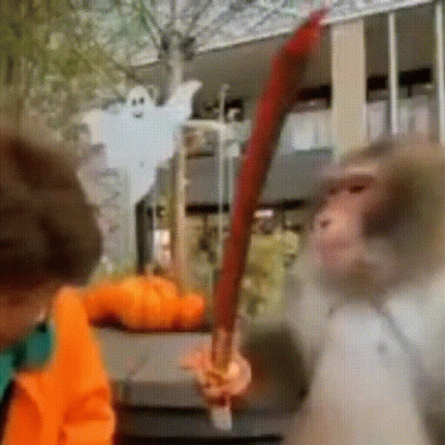 Orange Jacket Man with Red Sword Near Ghost