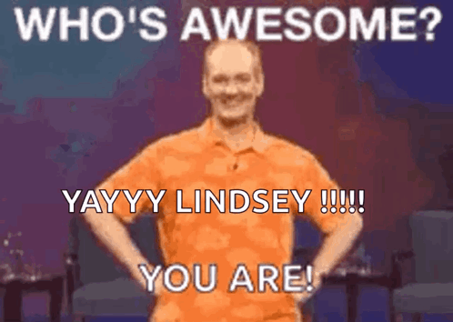 Orange Shirt Man Hands On Hips Saying Who's Awesome GIF