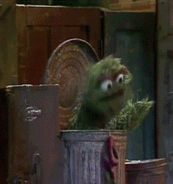 Oscar The Grouch Speaking From The Trashcan GIF