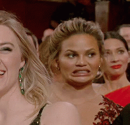 Oscars Cringe Chrissy Teigen GIF