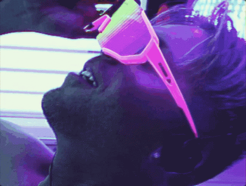 Over Tanning Guy With Shades GIF