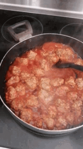Pan With Meatballs and Tomato Sauce Stirred