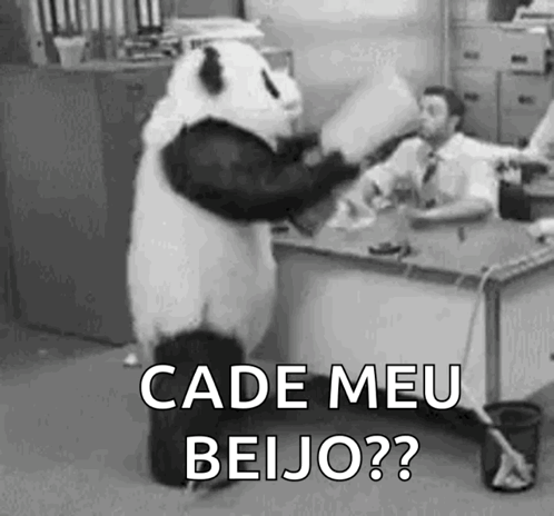 Panda Bear Standing in Front of Desk