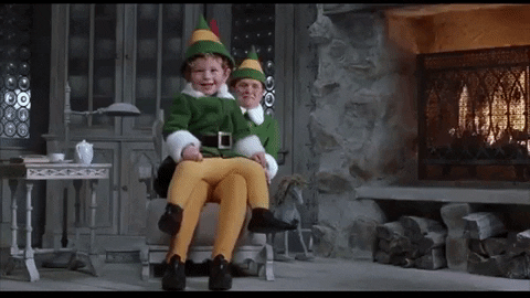 Papa Elf Carying His Child GIF