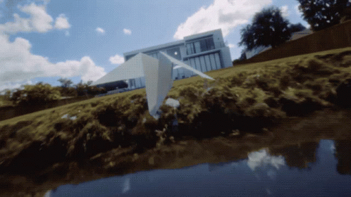 Paper Airplane Flying Over Water