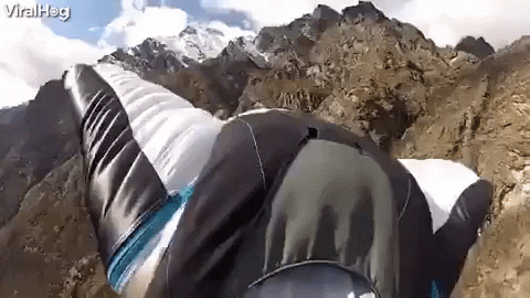 Paragliding Passing Another GIF