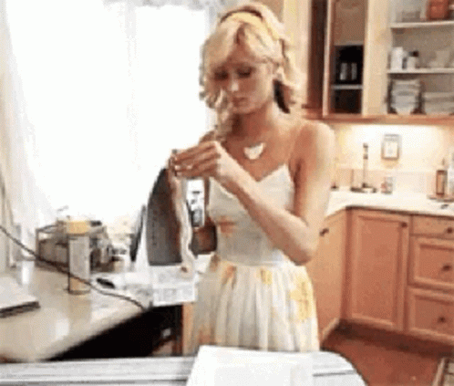 Paris Hilton Playing With Iron GIF