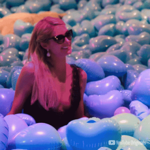 Paris Hilton Laying In Balloon GIF