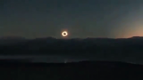Partial Eclipse of Sun Over Lake