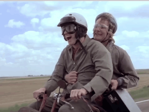 Passenger In Helmet And Goggles On Motorcycle GIF