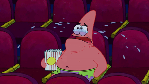 Patrick Star Crying While Holding A Bag Of Popcorn In A Theater GIF