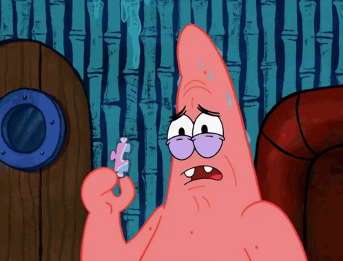 Patrick Star From Spongebob Is Holding A Piece Of Puzzle GIF