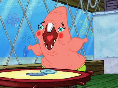 Patrick Star From Spongebob Squarepants Is Sitting At A Table With A Cd On It GIF