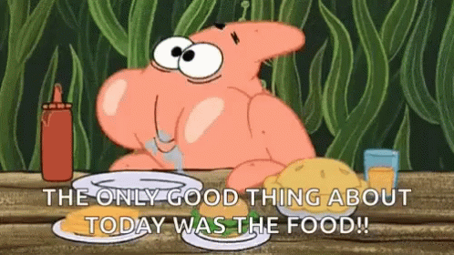 Patrick Star From Spongebob Squarepants Is Sitting At A Table With A Plate Of Food And A Bottle Of Ketchup . GIF