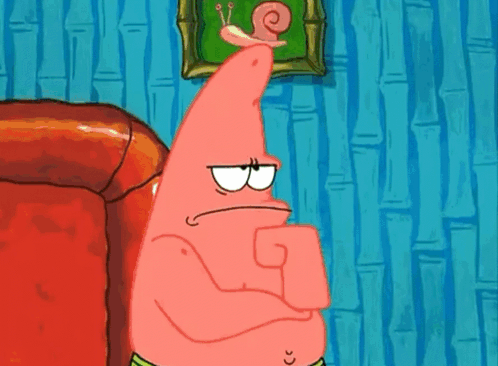 Patrick Star From Spongebob Squarepants Is Sitting On A Red Couch With His Arms Crossed . GIF
