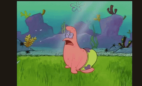 Patrick Star From Spongebob Squarepants Is Standing In A Grassy Field GIF