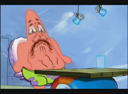 Patrick Star From Spongebob Squarepants Sitting At A Table GIF
