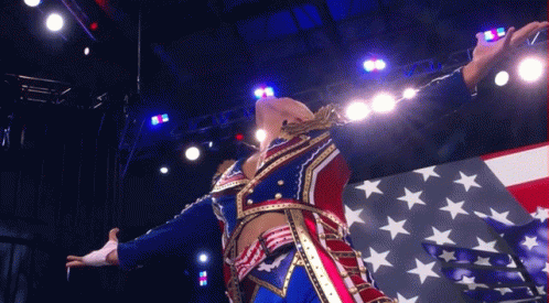 Patriotic Man Arms Outstretched in Front of American Flag