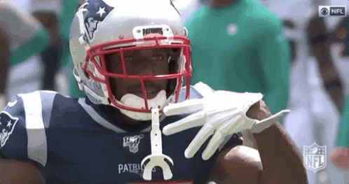 Patriots Football Player Holding Toothbrush