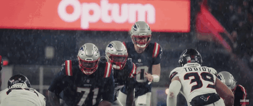 Patriots Football Players Lined Up In Front Of Optum Sign GIF