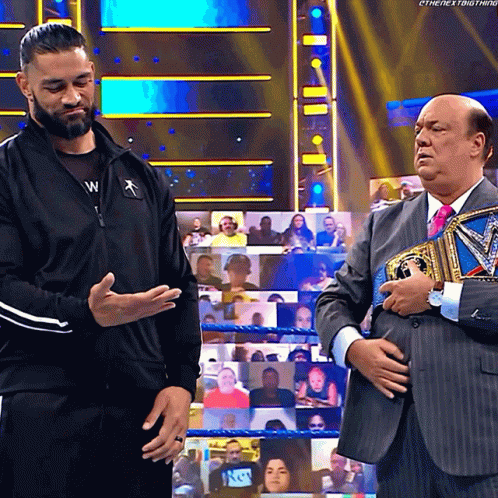 Paul Heyman Give The Microphone To Roman Reigns GIF