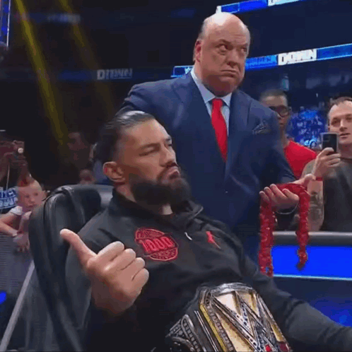 Paul Heyman With Roman Reigns Head Shake GIF