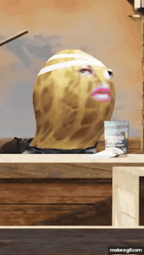 Peanut With Bandage on Head Sitting at Table