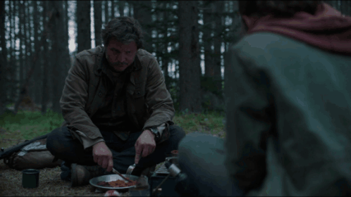 Pedro Pascal Eating Sandwich In The Forest GIF