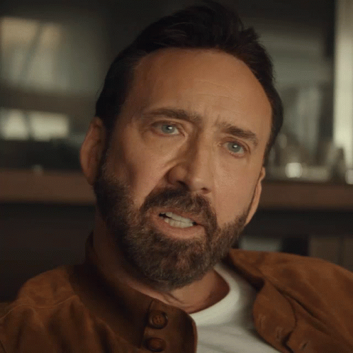 Pedro Pascal Nicolas Cage Suspicious Face React GIF