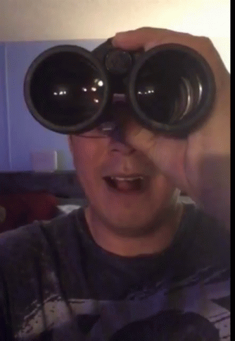 Peeping Tom Licking Lips Watching In Binoculars GIF
