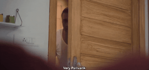 Peeping Tom Snooping Behind Door GIF
